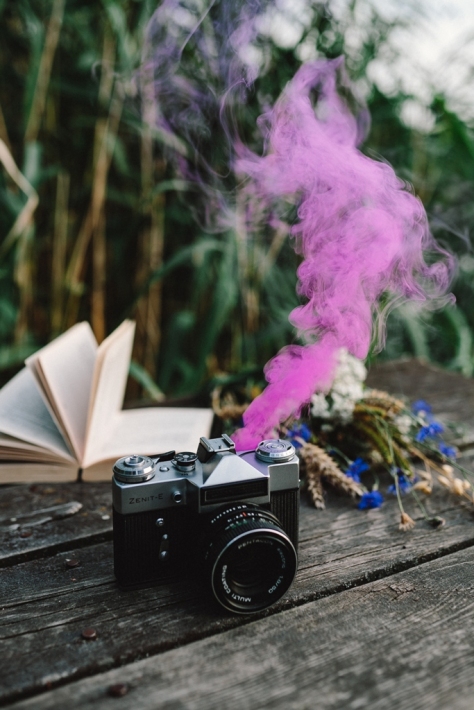 Old camera and pink smoke - by Karolina Grabowska